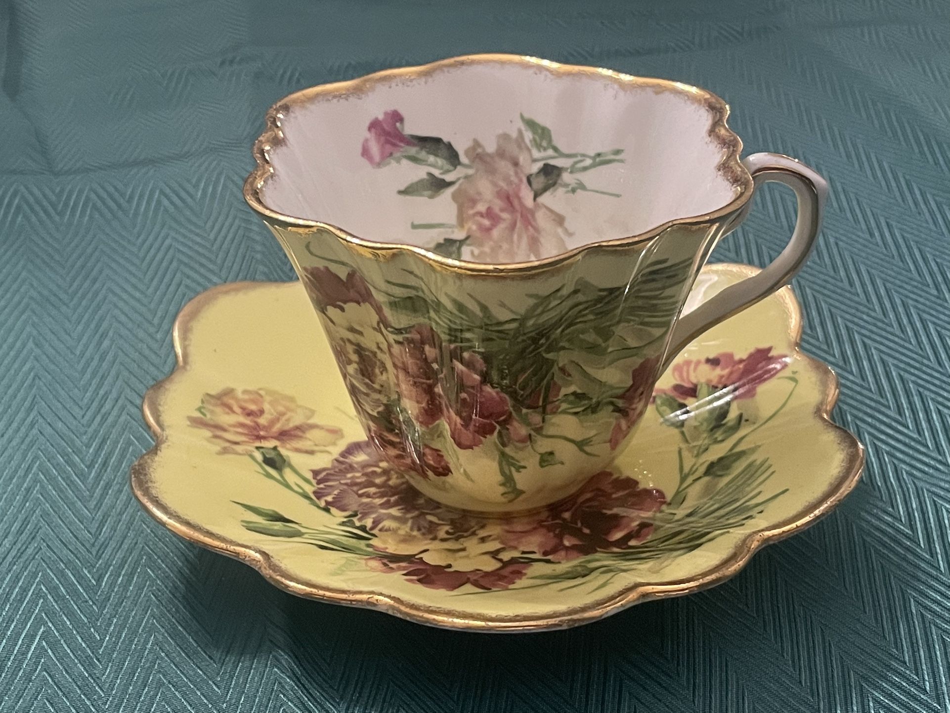 Vintage Rosina bone china teacup and saucer with floral design.
