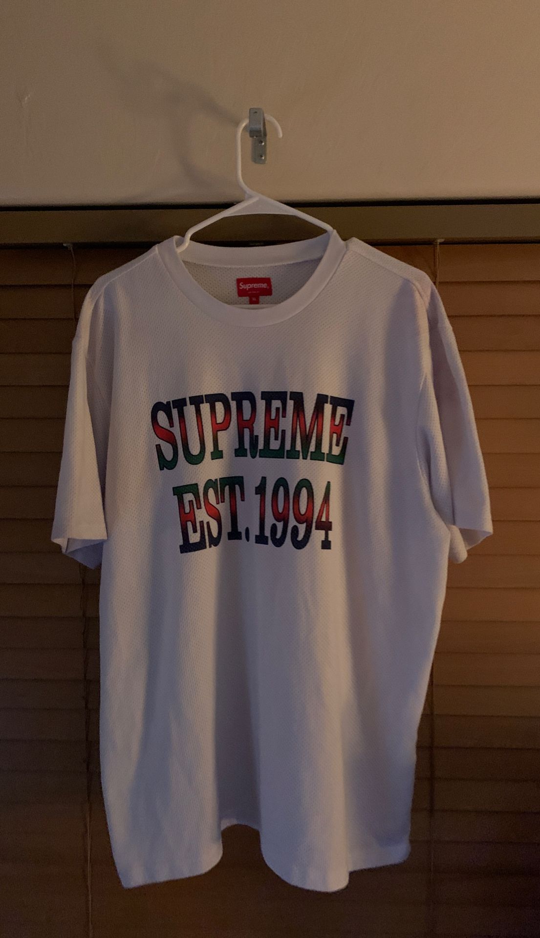 never worn. XL “supreme Est 1994” mesh shirt