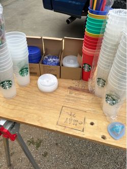Various Starbucks Cups with lids and straws