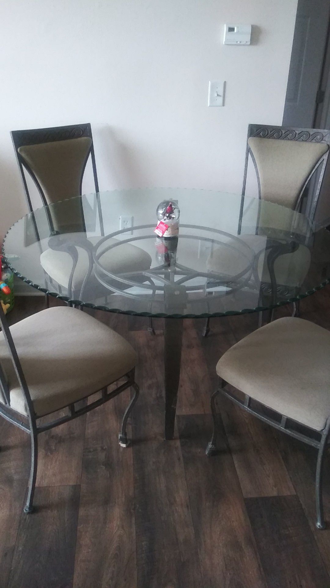 Glass round dining table with four chairs