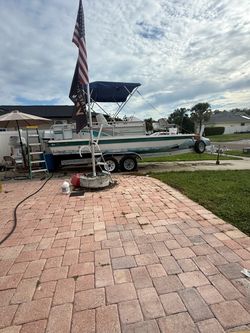 20 foot hurricane fiberglass deck boat with 90 hp engine tandem axle trailer and complete spare motor for parts