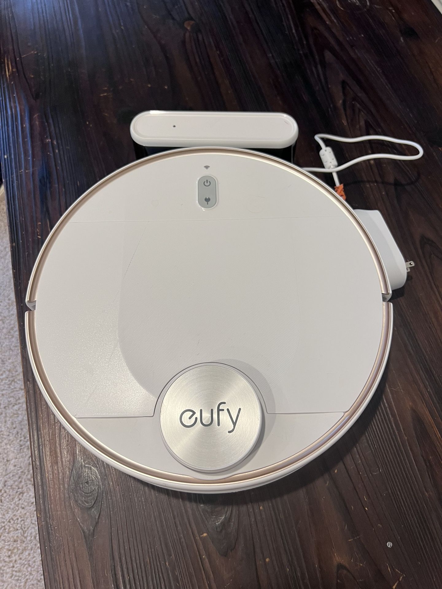 Eufy robot vacuum cleaner with charging dock. ( battery is not charging) sold as is
