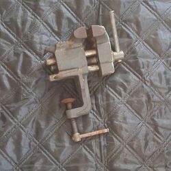 vintage clamp-on bench vise with a built-in rear anvil horn