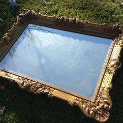 Beautiful antique brass Color Plastic Frame heavy wall mirror. Size 46"X33" in excellent condition. Asking $120.00