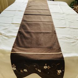 New Table Runner 72” X 14”, Brown With Embroidery And Ribbon Floral Work On Edges.