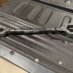 This is a Saris Bike Beam, a bike adapter bar used to mount bikes with non-traditional frames on hanging-style bike racks. 