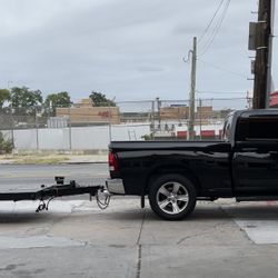 Black Dodge Ram With Car Trailer 