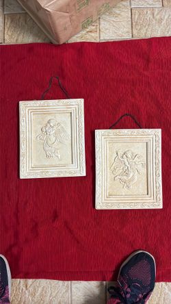 Two 8 x 9 wall hanging slightly under eight and 9 inches each
