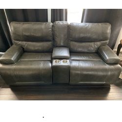 Leather sofa and loveseat power one.