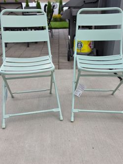 Brand new mint green metal chairs