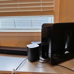 Sonos sound Bar, Subwoofer and two Speakers.