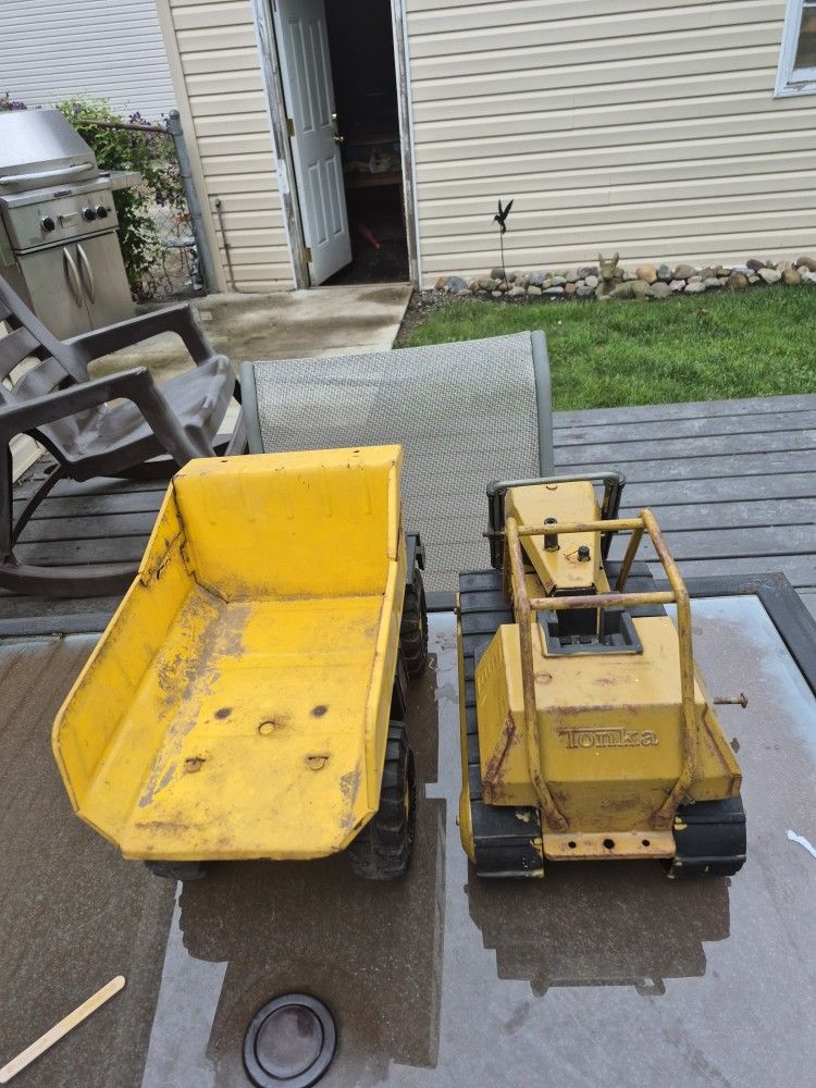 Two vintage tonka, vehicles, one dump truck and one bulldozer