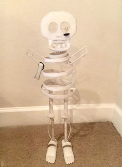 White metal slinky Halloween skeleton
