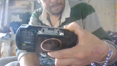 An Old Skool PSP with a game and a movie
