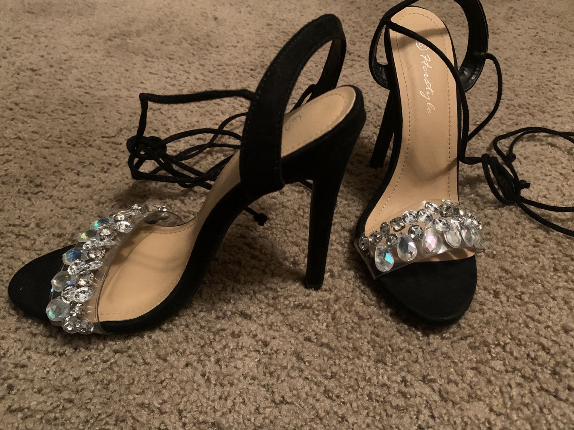 Black strap around high heels