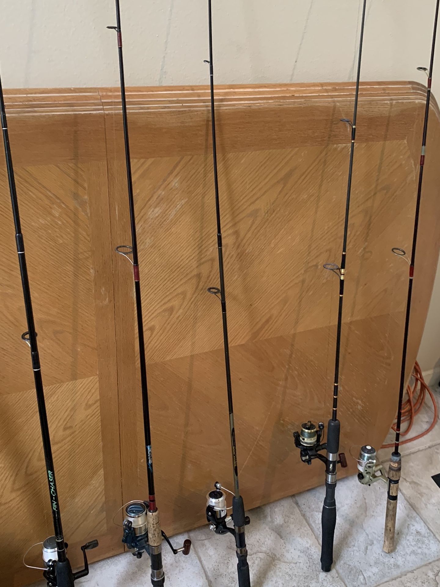 Five fresh water rods and reels