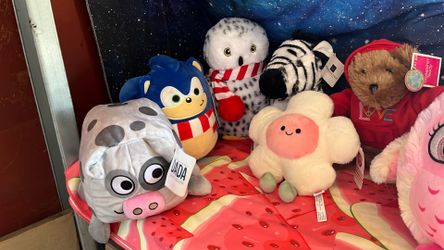 Assorted stuffies with tags