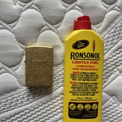 Copper Zippo Lighter With Mostly Full Bottle Of Fuel. 