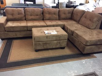 BRAND NEW SECTIONAL SOFA WITH DROP DOWN CUP HOLDER AND STORAGE OTTOMAN