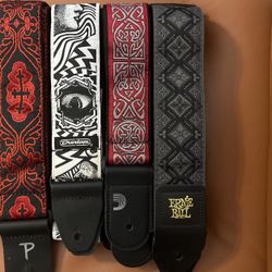 Four Red White Grey And Black Guitar Straps 