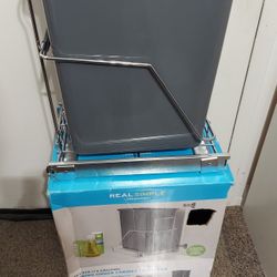 Sliding under cabinet trash can