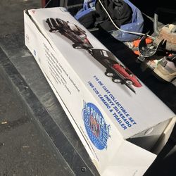 Die cast Ertl Diecast Weil McLain Chevy Silverado Truck with 1969 Camaro on a Trailer