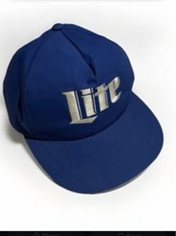 navy blue Miller Lite slouch strapback baseball cap with the brand's iconic script logo embroidered boldly in white across the front panels.
