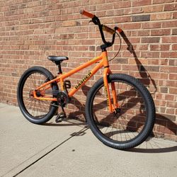 NEW 2025 SE BASHER 24 OUTRAGEOUS ORANGE SINGLE SPEED FREESTYLE WHEELIE RIPPER BIG BMX BIKE