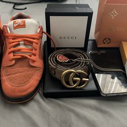 Orange lobsters-Gucci belt-Louis Vuitton band-gold chain-Samsung phone-gaming laptop