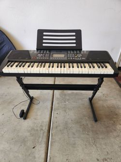 RockJam RJ561 61-key electronic keyboard. Comes with stand. Good condition. French Valley area.
