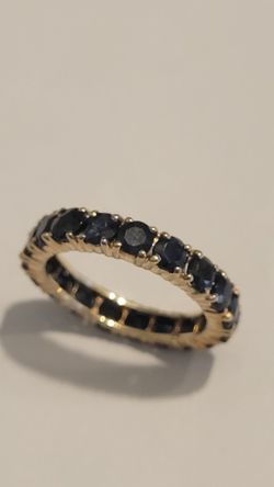 Eternity ring with sapphires September birthstone in 10 karat gold size 7 .5?  $350.00   location Pumpkin Center