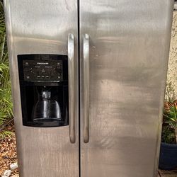 Fregidaire, Grey refrigerator, width 35, depth “including doors without handles” 26,height 70