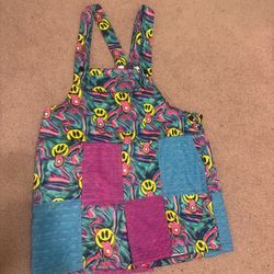 Playful patchwork overalls with neon smiley faces. Colorful swirl print with bold accents.  Bundle deals available please check out my other items and