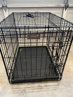 Metal dog crate, medium size black.