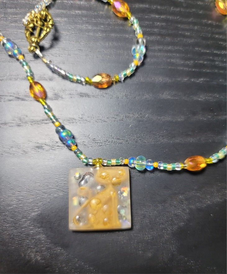 Beaded Necklace with Amber-Toned Square Pendant That Hides A Yellow Kitty.