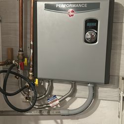 Rheem Performance 36 kW 7.03 GPM 240- Volt Self-Modulating Electric Tankless Water Heater.