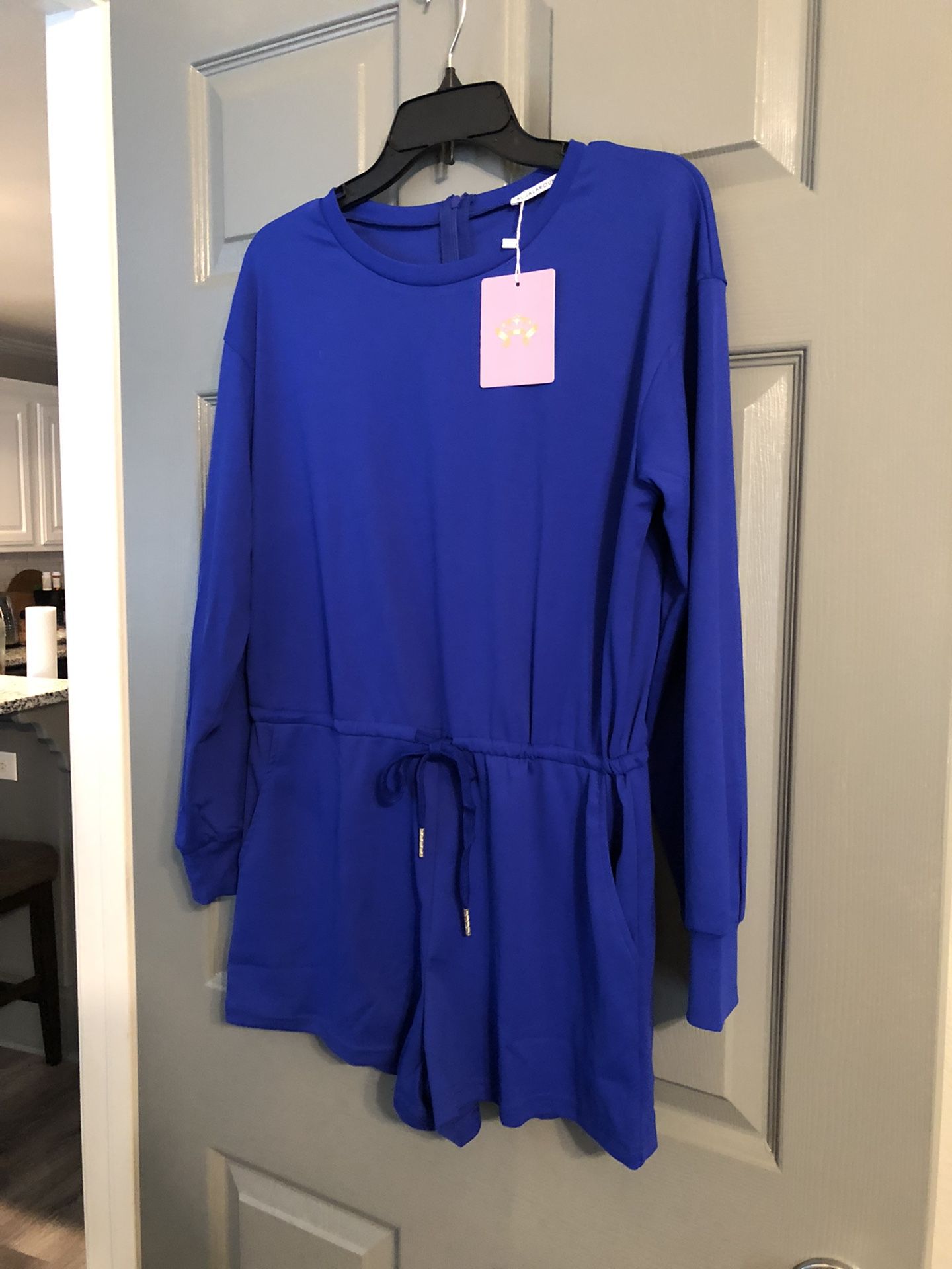Royal blue long sleeve short set with tie in the front and zipped up in the back brand new with tags
