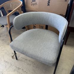 Modern  armchair in light grey with a black metal frame