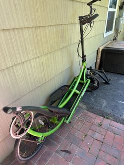 Green Elliptigo with stationary attachment