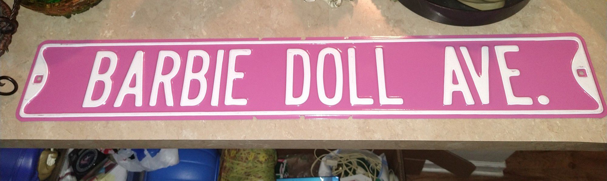 Large Pink Barbie Doll Ave metal sign. 36×6