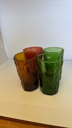 Four vintage hand blown glasses