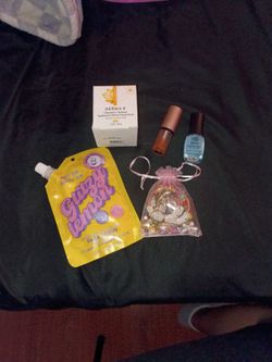 Face scrub facial peel nail polish lip oil and some other stuff in a lil bag jewelry/hair pin flower