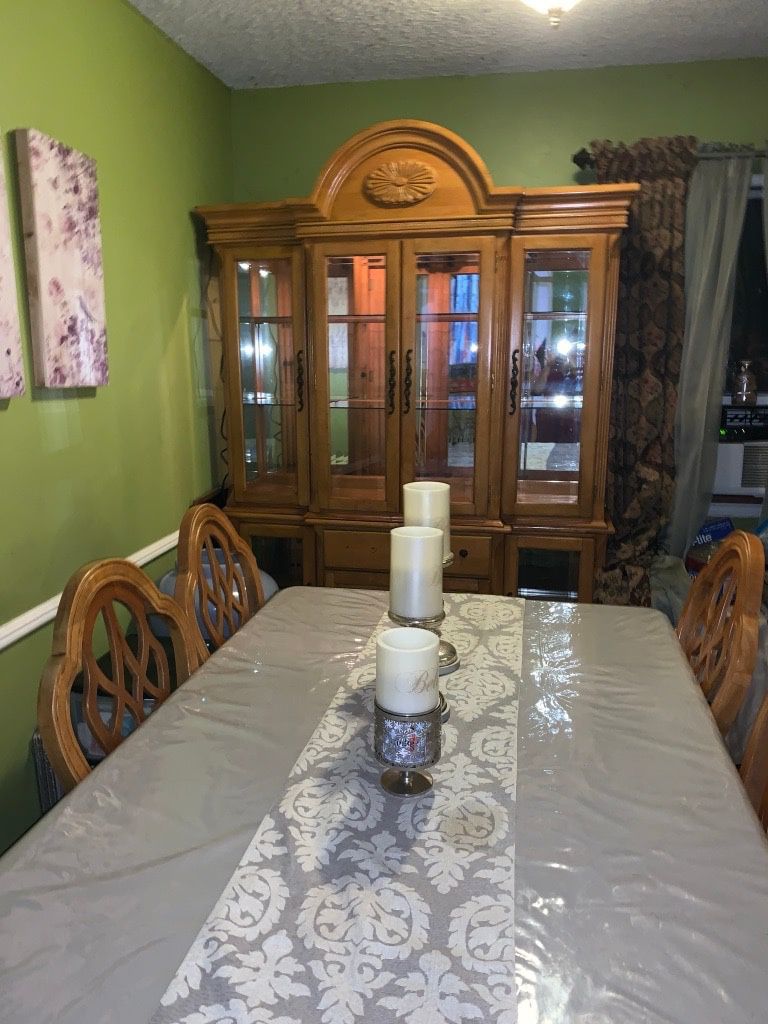China Hutch has inner light , and Dining Table ,and 4 chairs and 1 arm chair