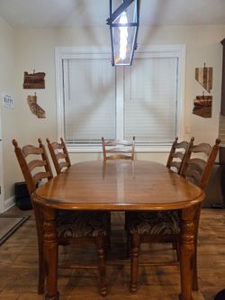 Wood Dining Table with 8 Chairs and matching hutch