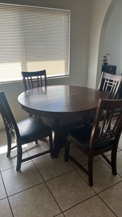 Round dining table and chairs