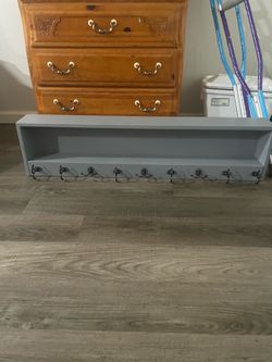 Hanging wall shelf with hidden drawer