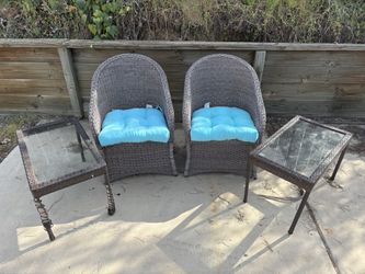 Outdoor patio chairs and side tables used