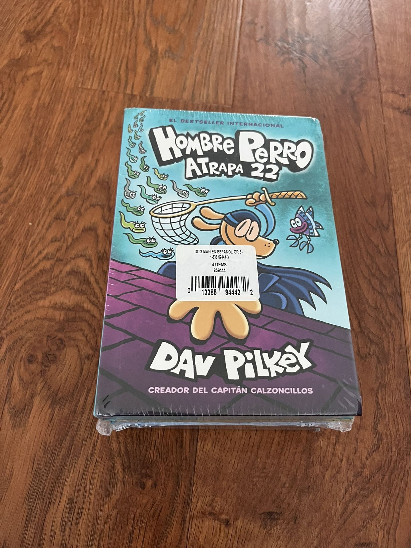hardcover Spanish edition of the graphic novel Hombre Perro