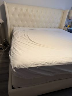 Gorgeous upholstered Off White wingback bed