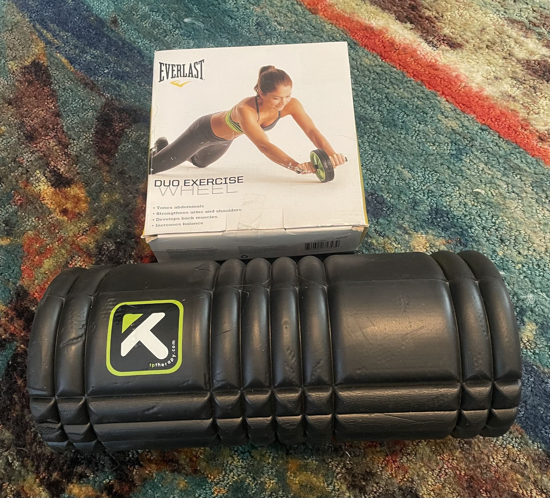 Everlast exercise wheel and a black foam roller. 